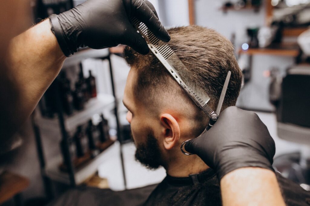 client doing hair cut barber shop salon learning how long does a fade haircut last