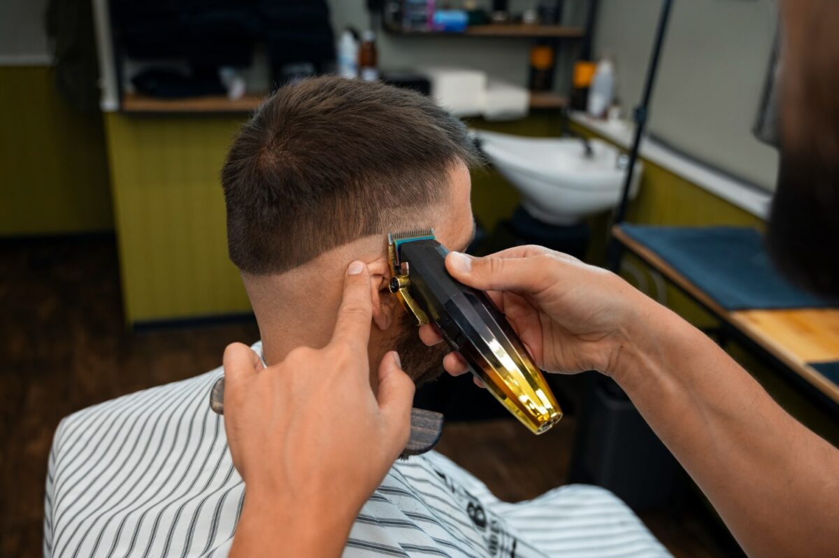 side view man getting haircut and learning how often do men get haircuts
